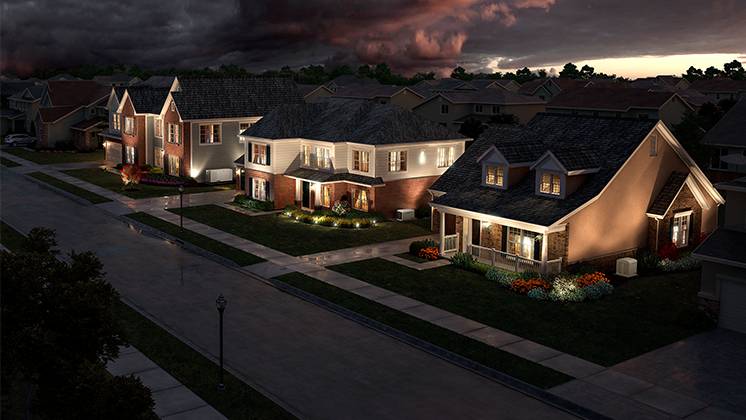Three houses illuminated with outdoor lighting